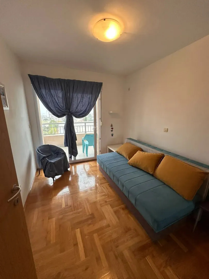 Smaller bedroom with a pull-out sofa and access to the terrace.
