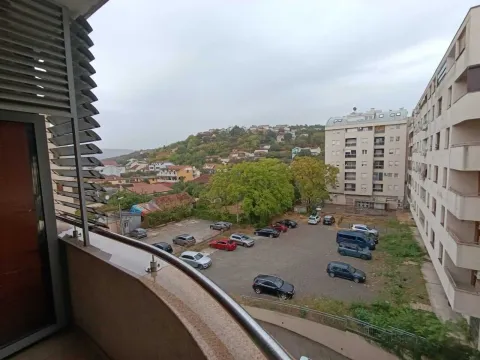View from the balcony overlooking the neighborhood and parking lot. - image 14