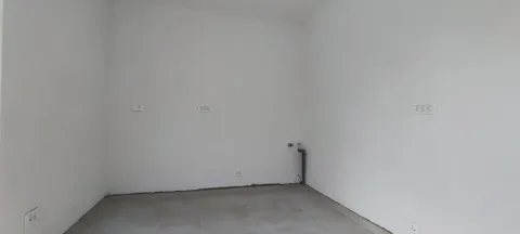 Empty room with white walls and electrical outlets. - image 6