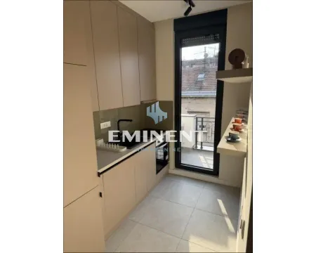 Small modern kitchen with built-in units and access to the terrace. - image 11