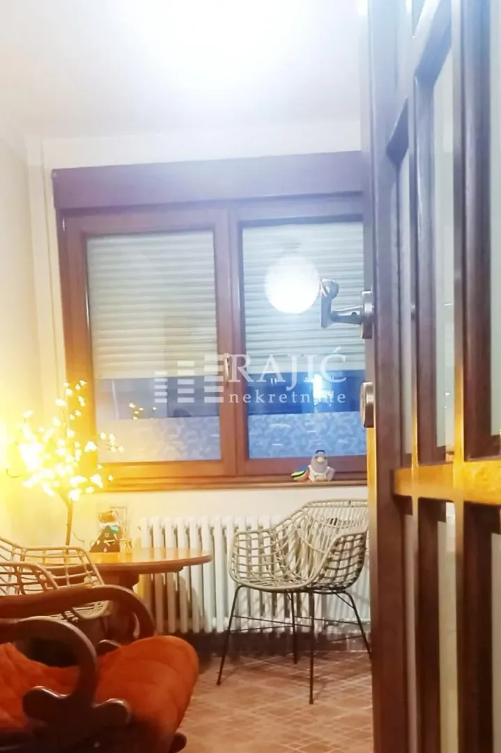 Small living room with furniture and a window.