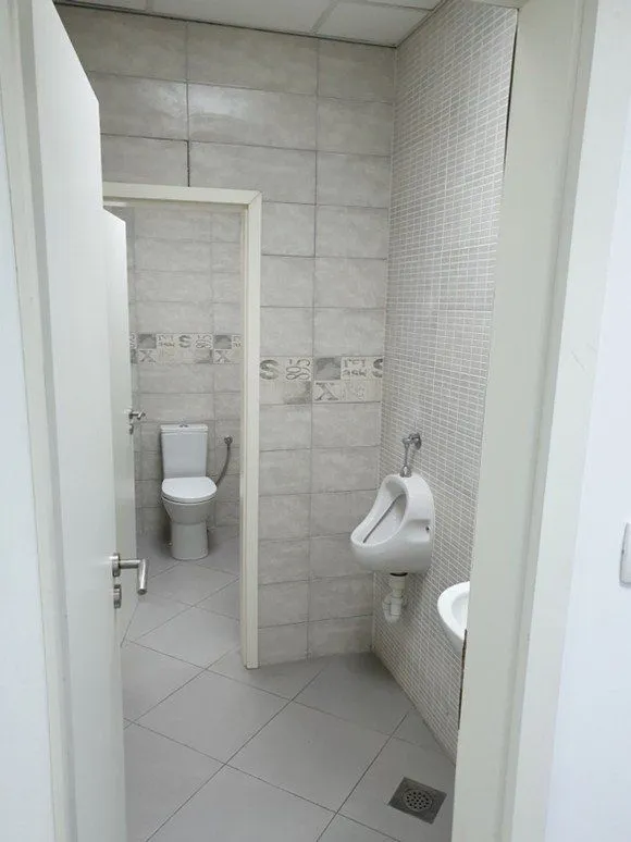 A view of a modern bathroom with sanitary facilities.