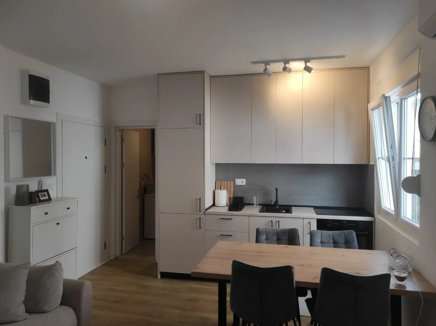 Modern kitchen connected to the dining area.