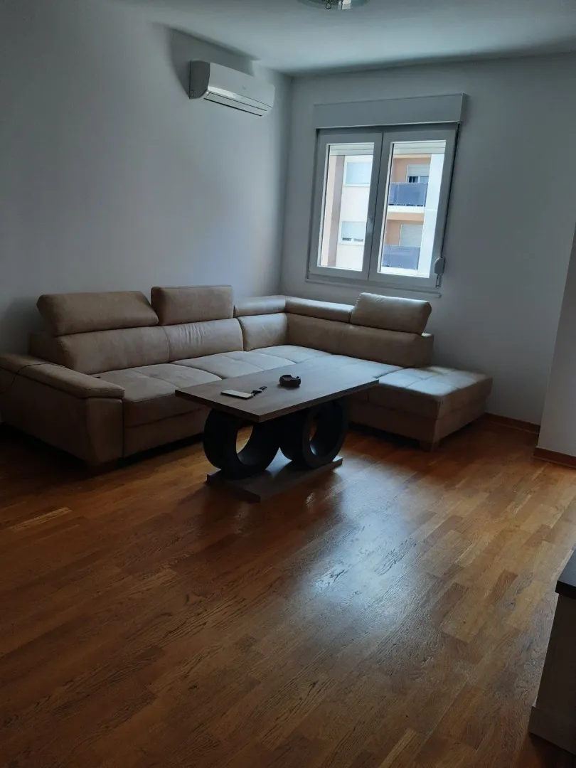 Living room with a corner sofa and a coffee table.