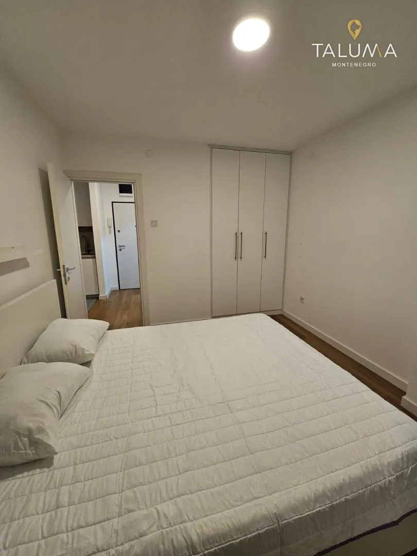 Bedroom with a double bed and a fitted wardrobe.