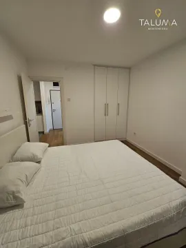 Bedroom with a double bed and a fitted wardrobe. - image 5