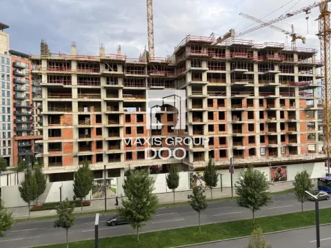 View of a residential building under construction with cranes. - image 16