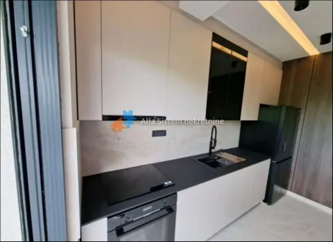 Modern kitchen equipped with built-in appliances. - image 13