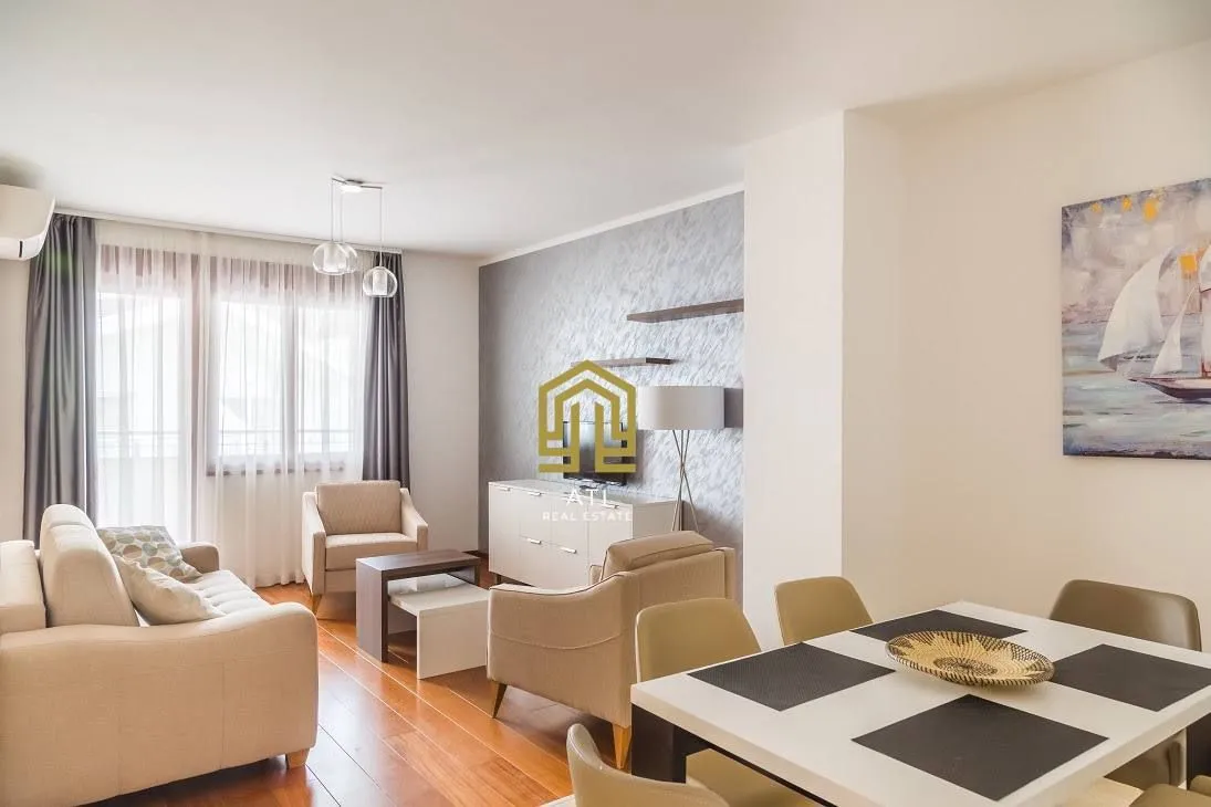 Spacious living room with a sofa set and dining table.