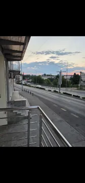 View from the terrace overlooking the city street and surrounding buildings. - image 3