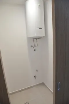 Part of a bathroom with a mounted water heater. - image 4