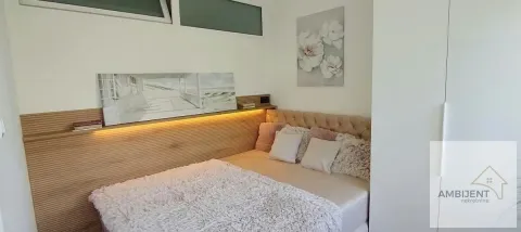 Small bedroom with a double bed and decorative wall panels. - image 13