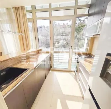 Modern kitchen with large windows and access to the terrace. - image 10