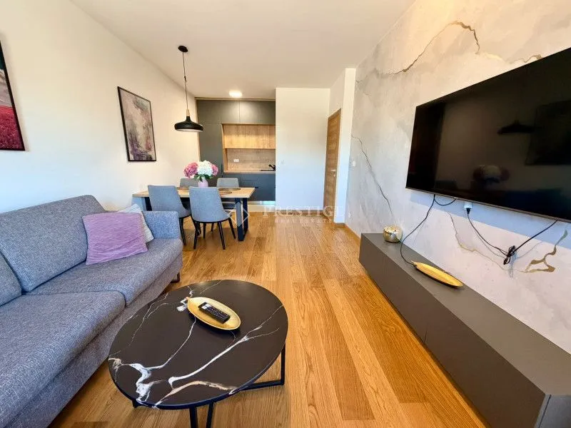 Living room connected to the dining area and kitchen.