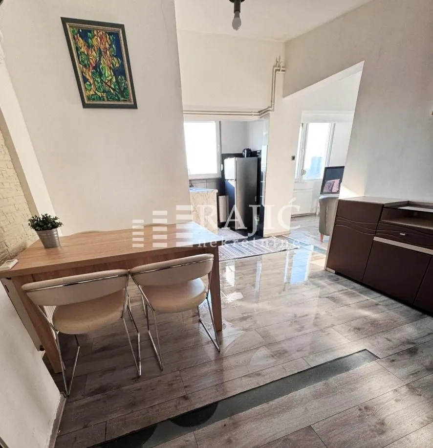 Living room with a dining table and chairs.