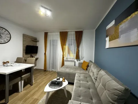 Spacious living room with a sofa set, dining table, and modern details. - image 7