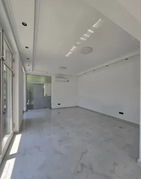 Empty bright room with tiled floor and white walls. - image 6