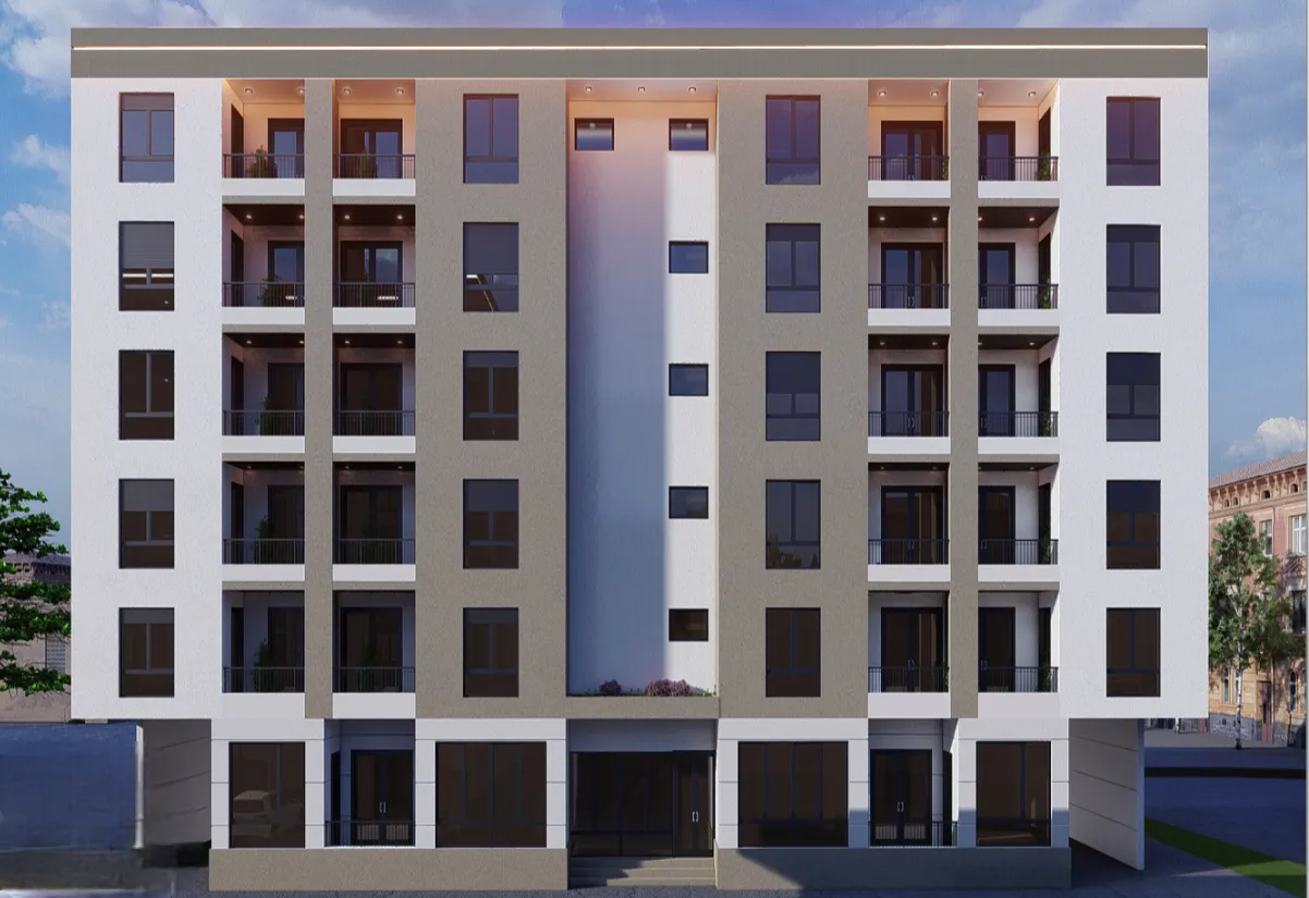 Front facade of a modern residential building with balconies.