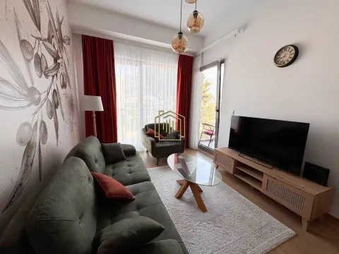 Living room with sofa, TV unit, and access to the balcony. - image 3