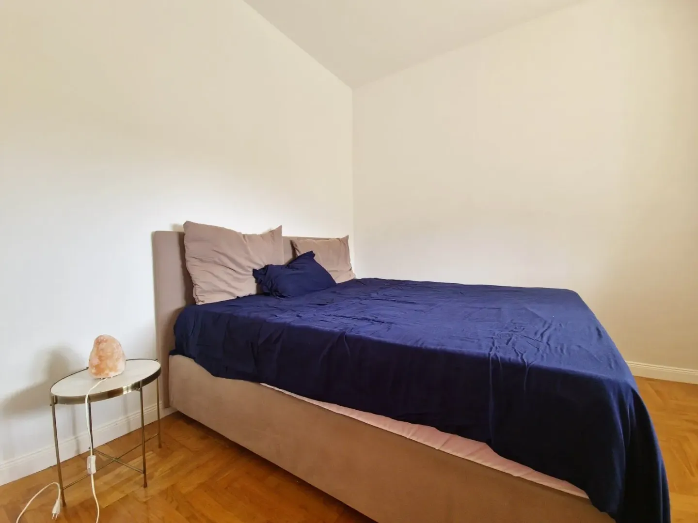 Bedroom with a double bed and a nightstand.