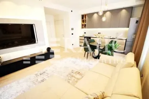 Living room connected with the kitchen and dining area in a modern apartment. - image 4