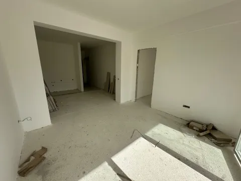 Empty room in an apartment under construction with white walls. - image 2