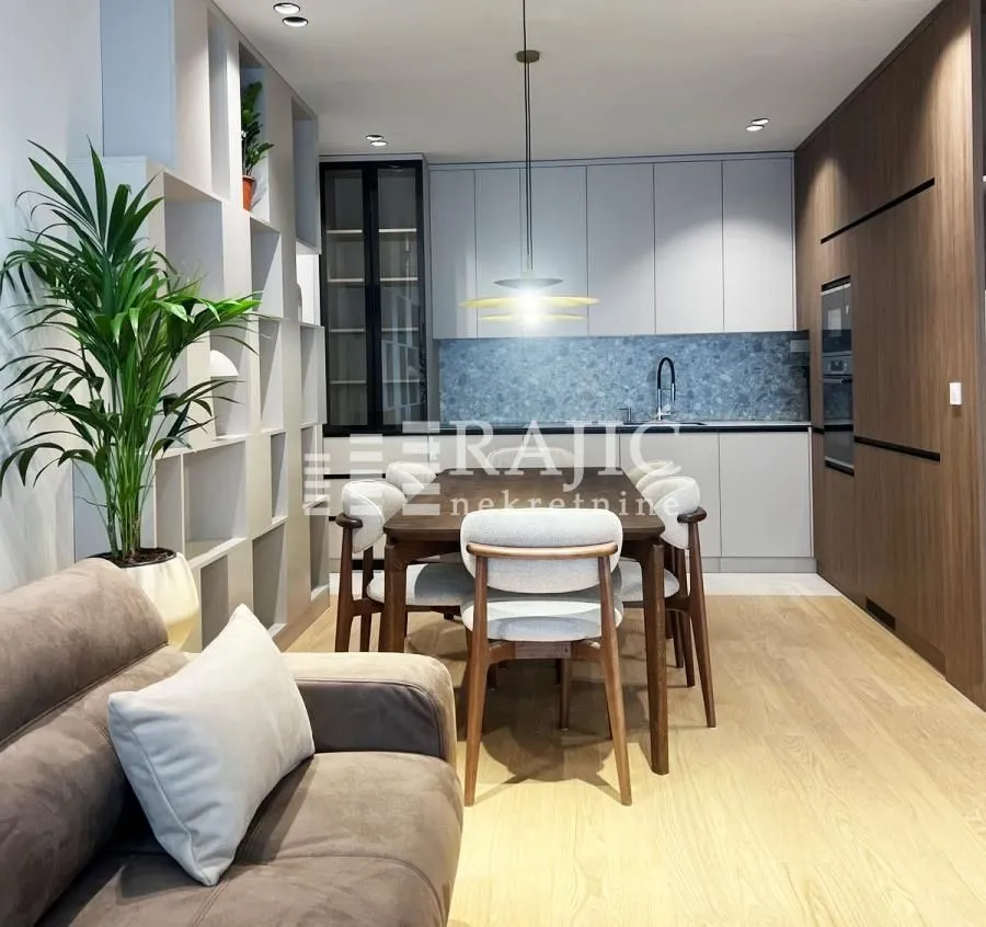 Living room with dining area and kitchen in a modern interior.