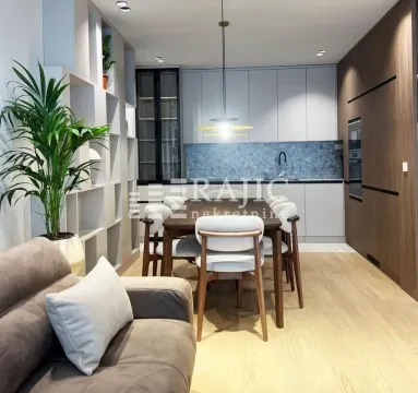 Living room with dining area and kitchen in a modern interior. - image 4
