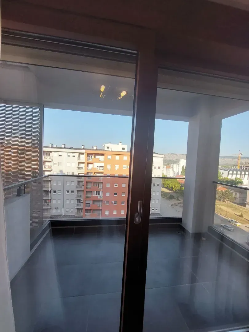View from the balcony onto surrounding buildings.