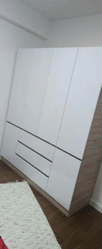 Large white wardrobe in the bedroom.