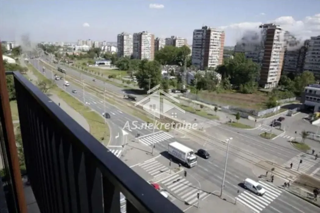 View from the terrace of the city street and surrounding buildings.