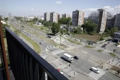 View from the terrace of the city street and surrounding buildings. - image 12