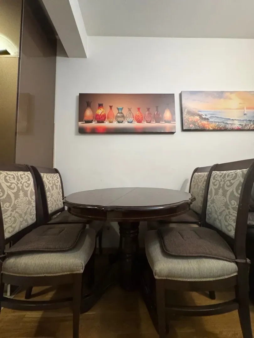 Dining table with four chairs in the interior.