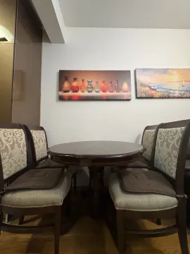 Dining table with four chairs in the interior. - image 3