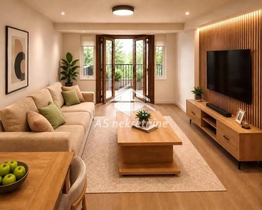Modern living room with a sofa, TV, and access to the terrace.