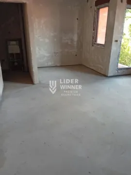 Unfinished room under construction with concrete floor and bare walls. - image 7