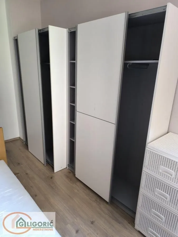 Large white sliding door wardrobe in the bedroom.