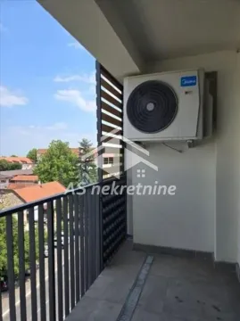 Covered balcony with an air conditioning outdoor unit and a street view. - image 10