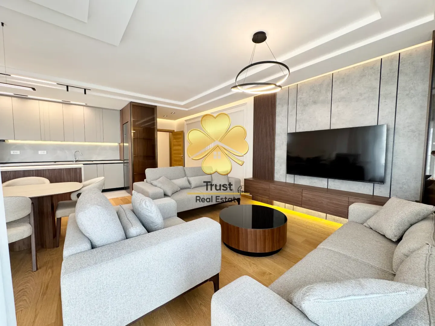 Modern and bright living room connected to the dining area and kitchen.
