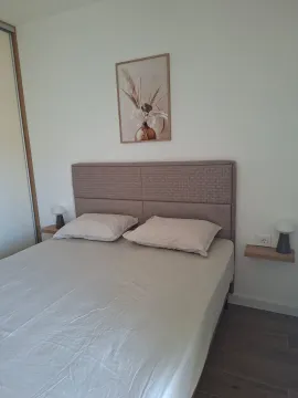 Furnished bedroom with a double bed. - image 8