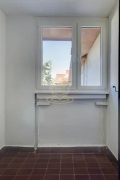 Small room with a window and tiled floor. - image 4