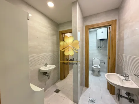 Modern bathroom with a washbasin and toilet. - image 14