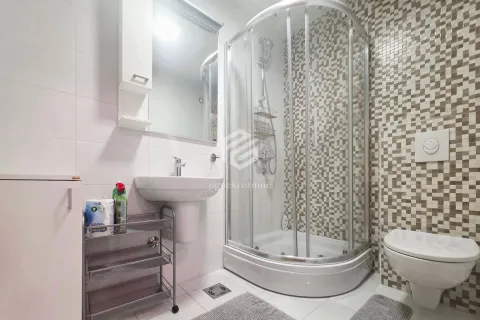 Bathroom equipped with a shower cabin, washbasin and toilet. - image 4