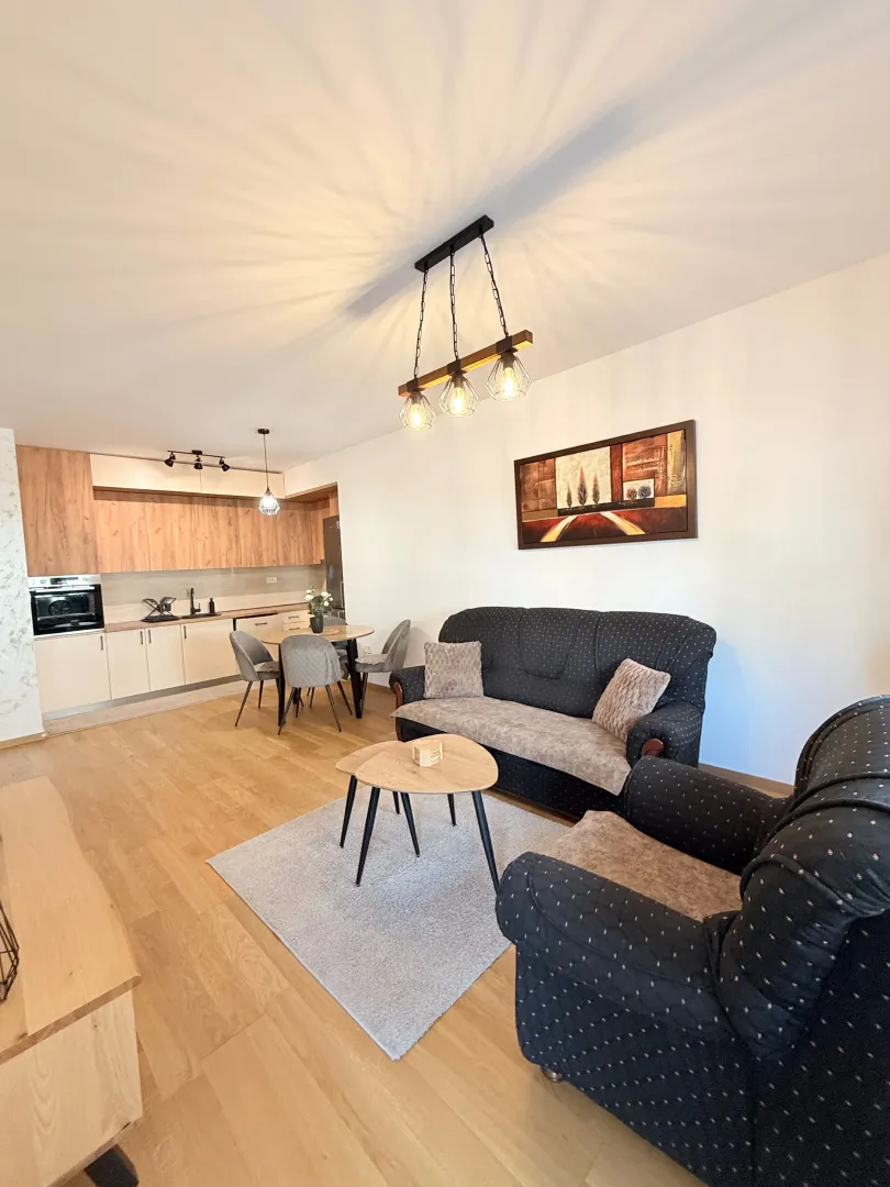 Spacious living room connected to the dining area and kitchen.
