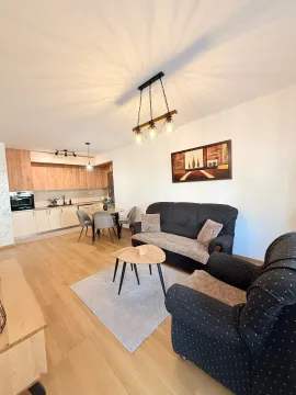 Spacious living room connected to the dining area and kitchen. - image 3