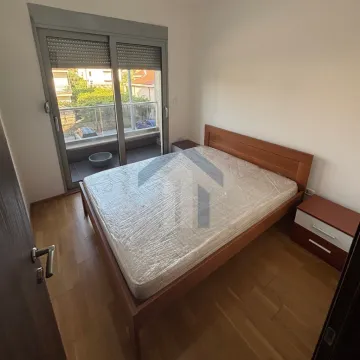Bedroom with a double bed, bedside tables, and access to the terrace. - image 7