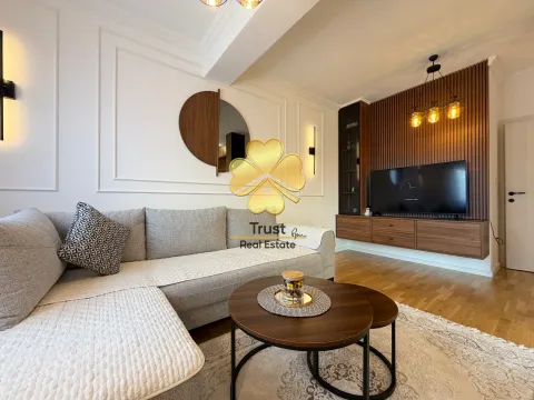 Modern and bright living room with a sectional sofa and wooden wall paneling. - image 3
