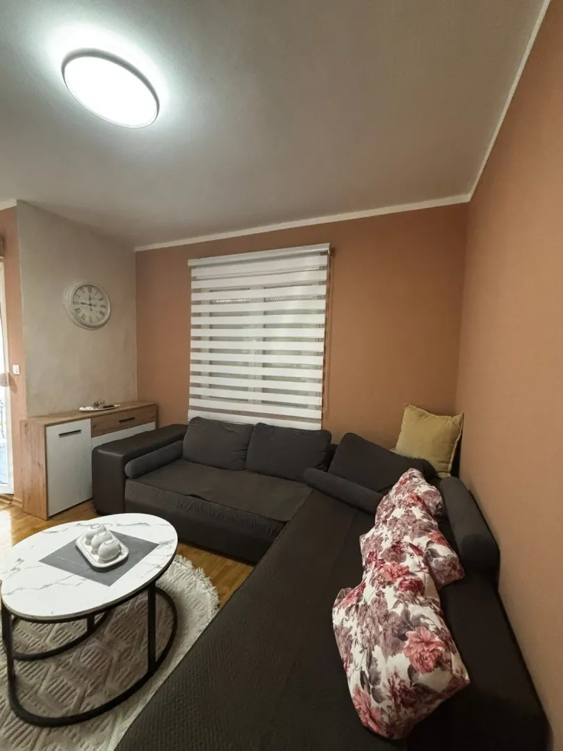 Comfortable living room with a corner sofa and a coffee table.