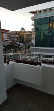View from the terrace overlooking the city and nearby buildings. - image 2