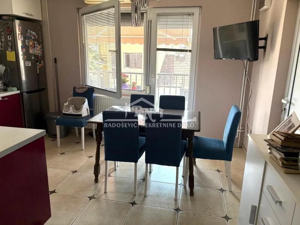 Dining table with chairs in the kitchen area.